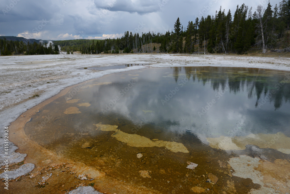 Hot water pool at Old Faithful geothermal area in Yellowstone National Park, Wyoming, USA Hot water pool at Old Faithful geothermal area in Yellowstone National Park, Wyoming, USA
