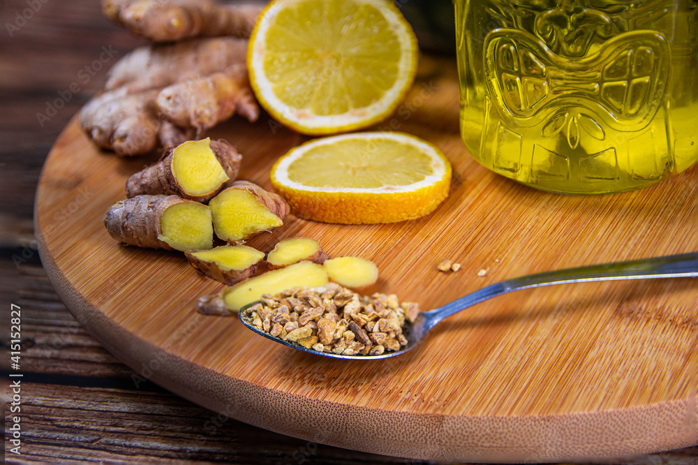 Ingredients to prepare a ginger and lemon infusion. Concept of natural medicine and homeopathy