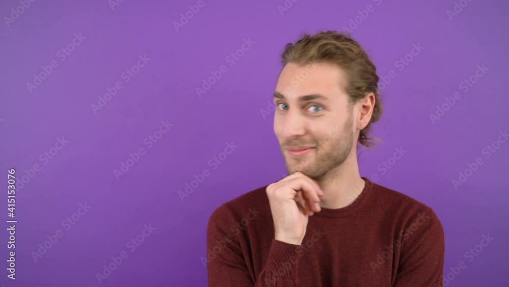 portrait of a thinking man. long haired man isolated on purple background 4K portrait of a thinking man. long haired man isolated on purple background 4K