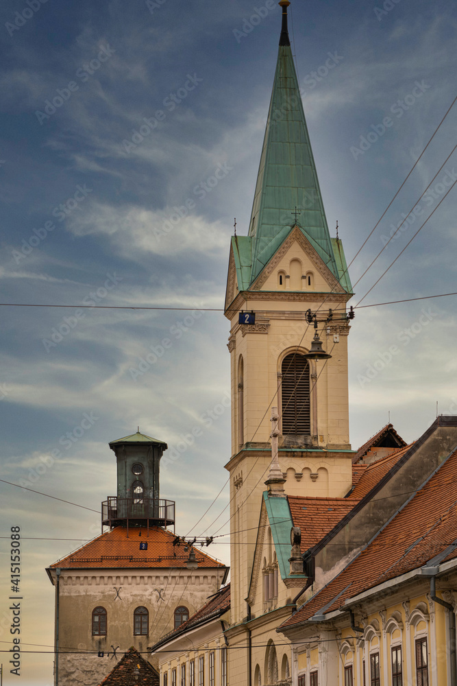 The Historic Lotrscak Tower in the background with a Greek Orthodox Seminary in the foreground, Zagreb, Croatia The Historic Lotrscak Tower in the background with a Greek Orthodox Seminary in the foreground, Zagreb, Croatia