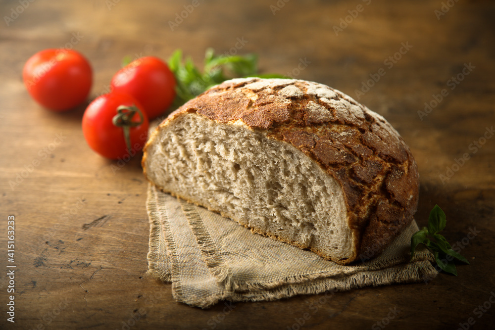 Traditional artisan bread on a wooden desk