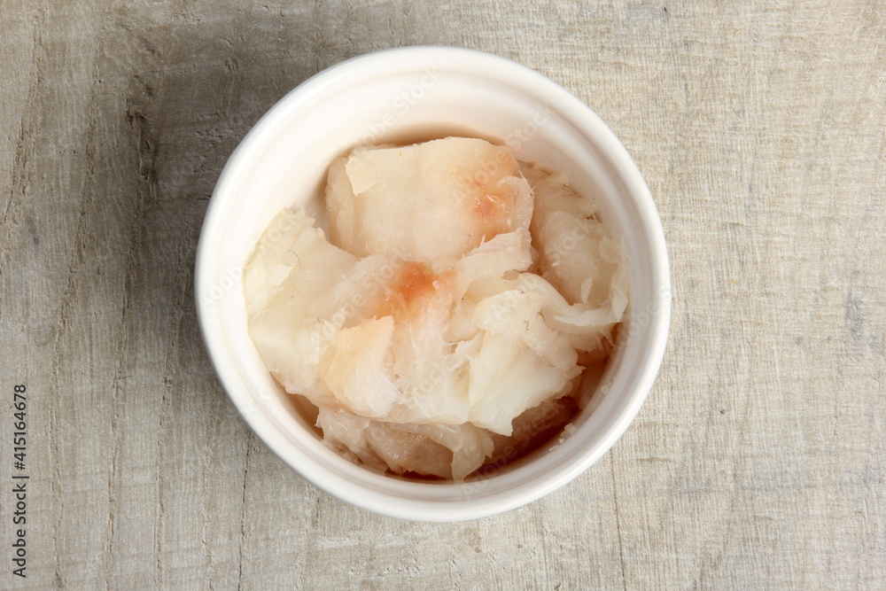 several dishes with raw fresh fish pieces before frying. dishes with unroasted julienne. Sliced white fish fillet in white pots several dishes with raw fresh fish pieces before frying. dishes with unroasted julienne. Sliced white fish fillet in white pots