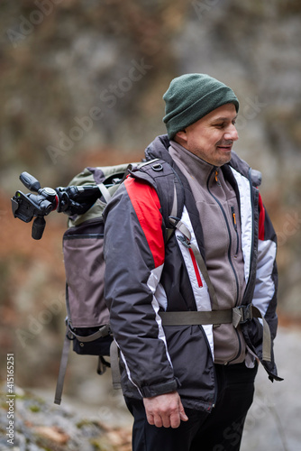 Professional photographer working in nature on a winter day in the mountains. © czamfir