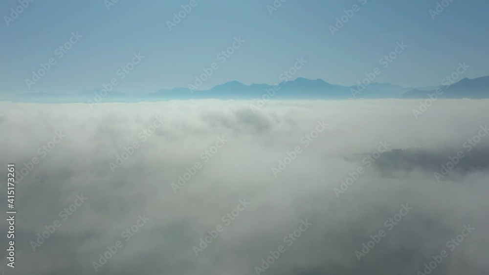 flying through clouds with view on Alp mountain landscape flying through clouds with view on Alp mountain landscape