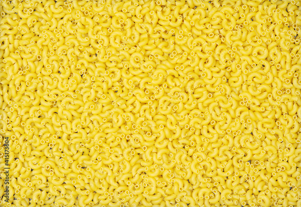 Italian pasta (Gomiti Rigati) on white background Italian pasta (Gomiti Rigati) on white background