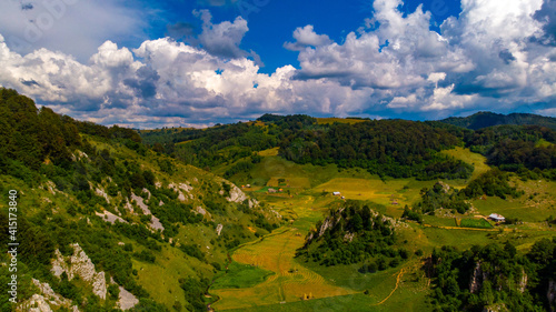 view from the hill with the green valley and the hollow rocks without trees