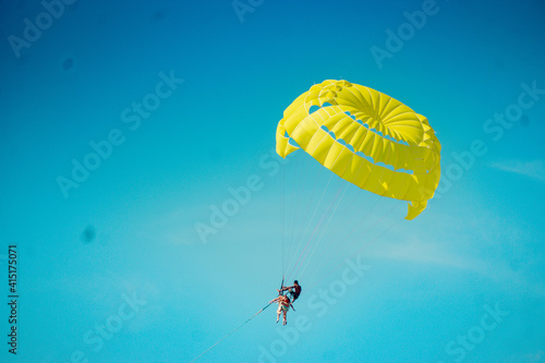paraglider in the blue sky