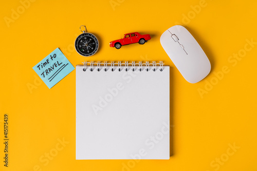 Travel concept. Flat lay on the table with notepad and travel accessories