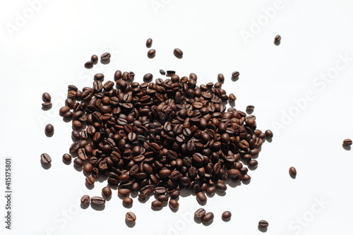 Textured background with robusta and arabica coffee beans closeup. Every day, people drink aromatic strong espresso in the morning. A popular world tradition in every country. Macro view backdrop