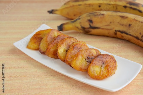 Bilde på lerret Fried slices of ripe plantains, traditional and popular snack in Central America
