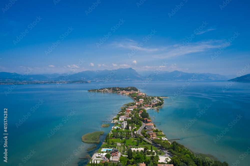 Aerial view of Sirmione, Colombare, Lake Garda, Italy. In the background of blue sky