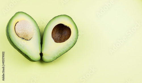 Avocado halves, one with the grain, the other without