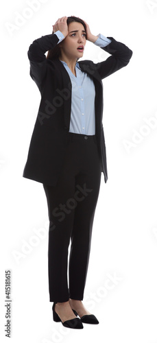 Young stressed businesswoman in elegant suit on white background