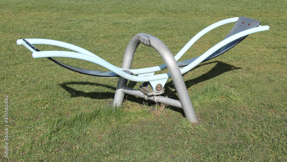 A Modern Metal Framed See-Saw Childs Playground Toy. A Modern Metal Framed See-Saw Childs Playground Toy.