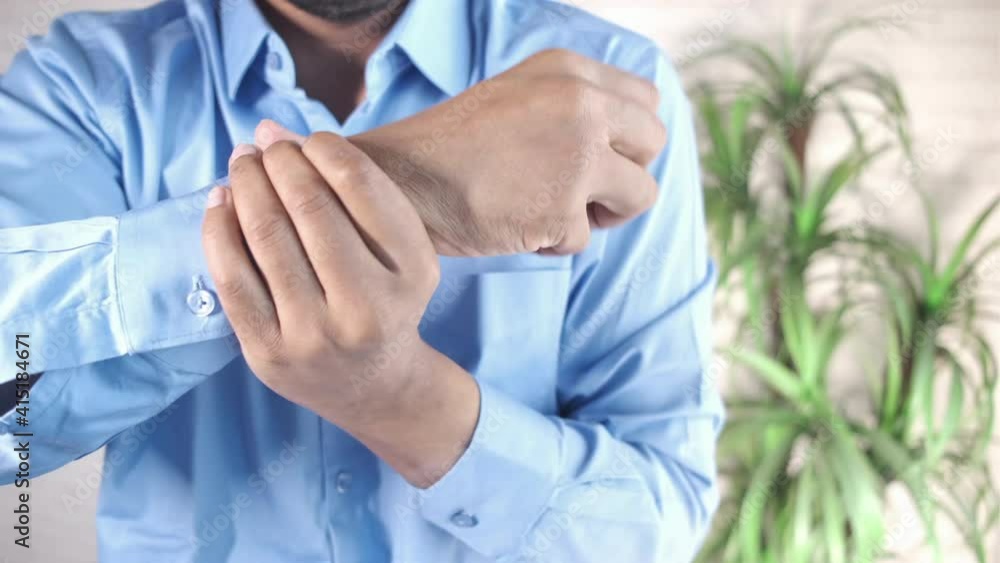 man suffering pain in hand close up man suffering pain in hand close up