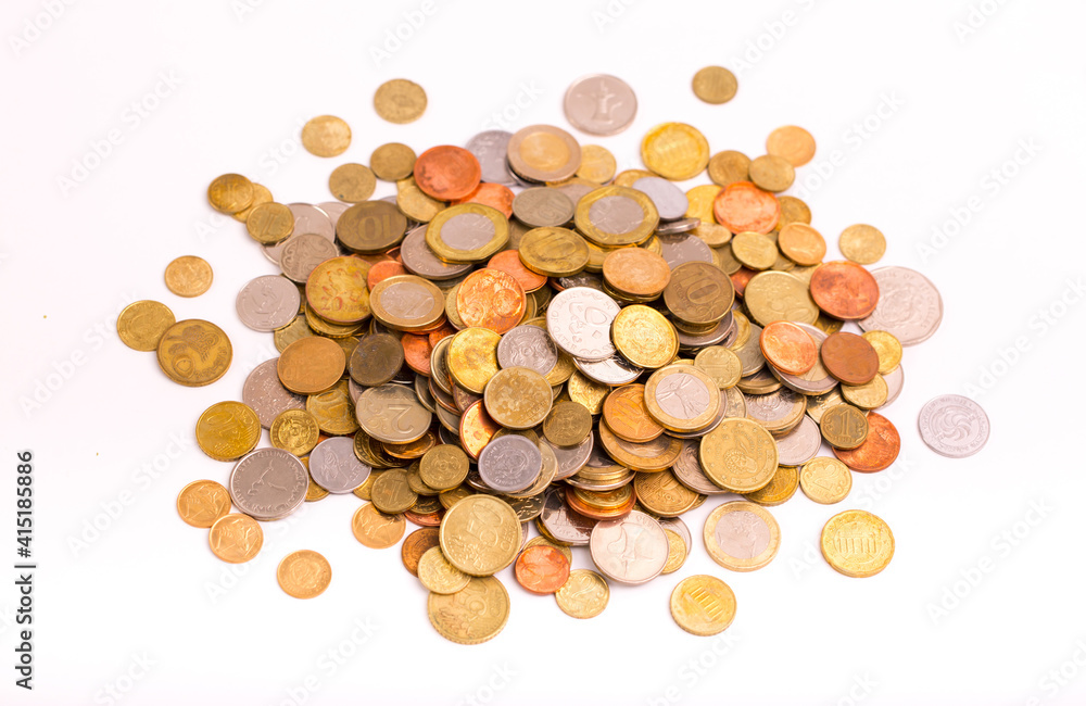 Different money coins. Money US dollars and euros on a white background. Savings and savings. Coins of different nominal from different countries. Different money coins. Money US dollars and euros on a white background. Savings and savings. Coins of different nominal from different countries.