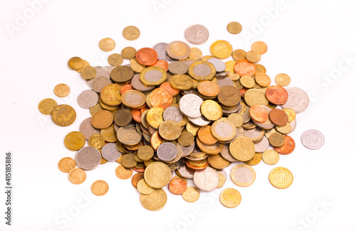 Different money coins. Money US dollars and euros on a white background. Savings and savings. Coins of different nominal from different countries.