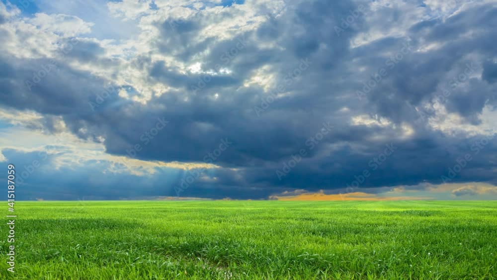 green rural field under a dense cumulus clouds, cuontryside agricultural time lapse scene green rural field under a dense cumulus clouds, cuontryside agricultural time lapse scene