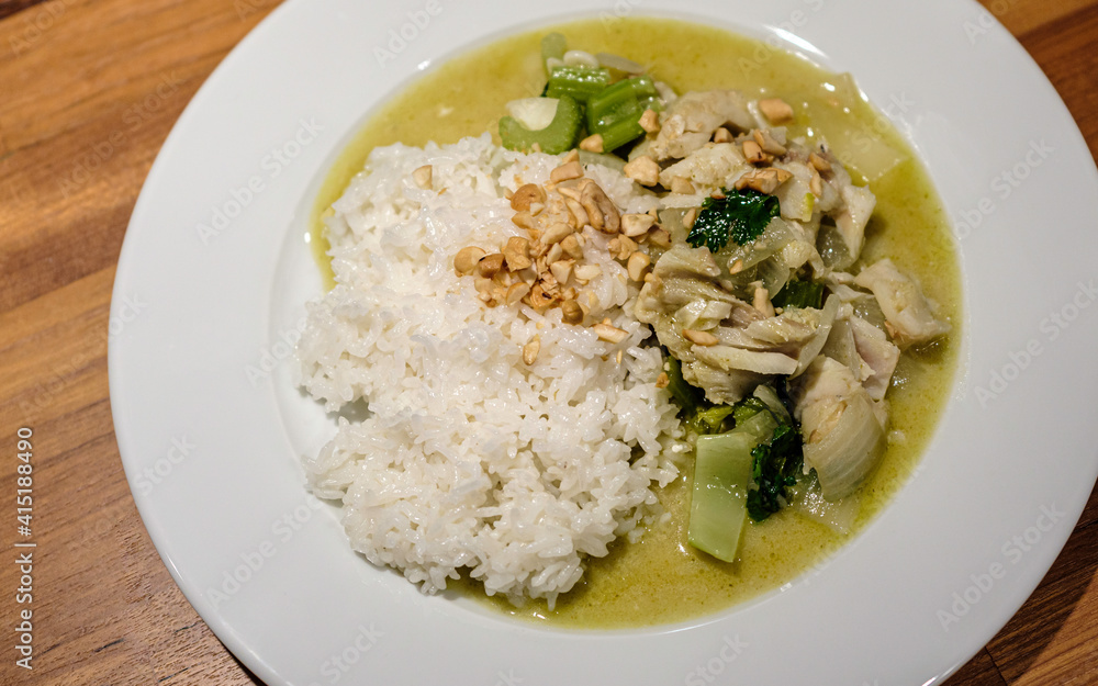 Chicken Curry with White Rice and Crushed Cashews