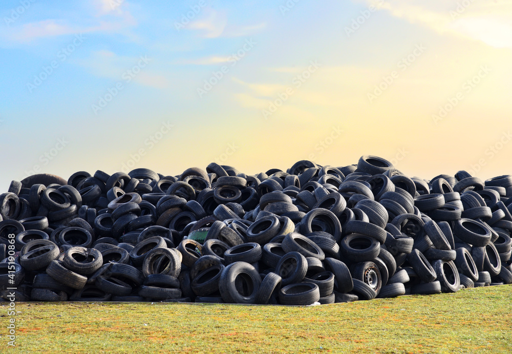 Waste tires and tyres at landfill for recycling. Regenerated tire