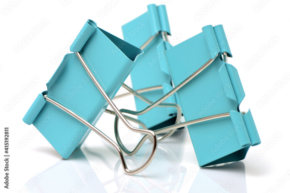Four binder clips isolated on white background Four binder clips isolated on white background