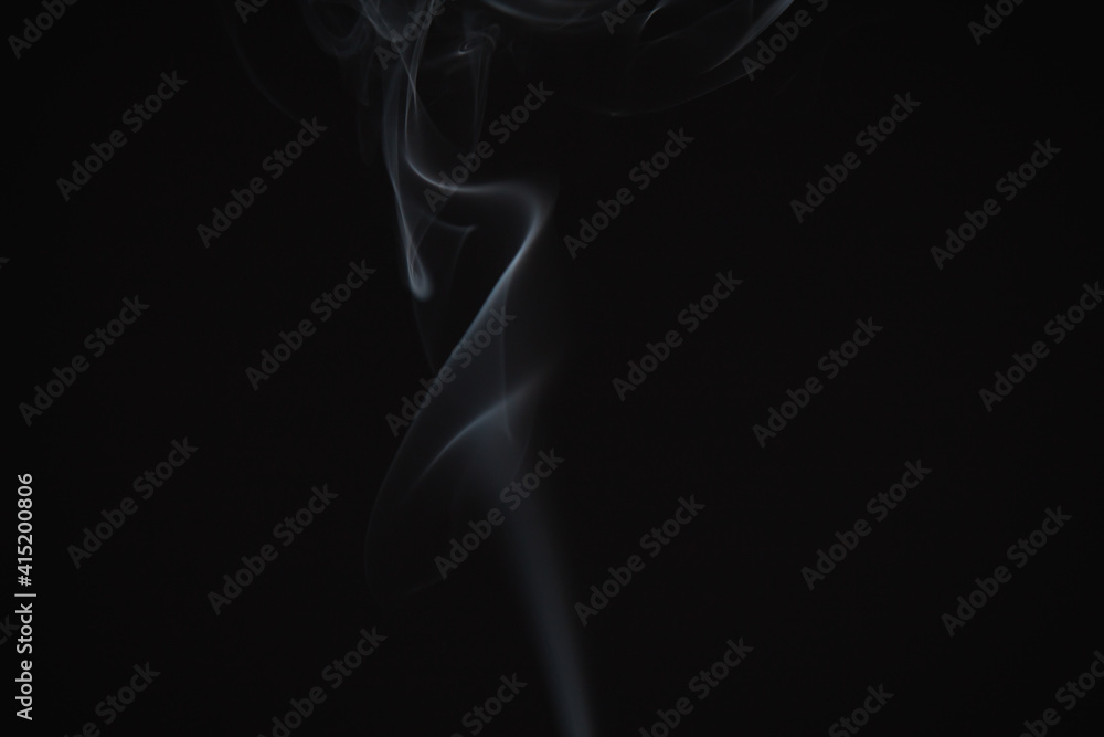 Incense burning giving of different patterns of smoke Incense burning giving of different patterns of smoke