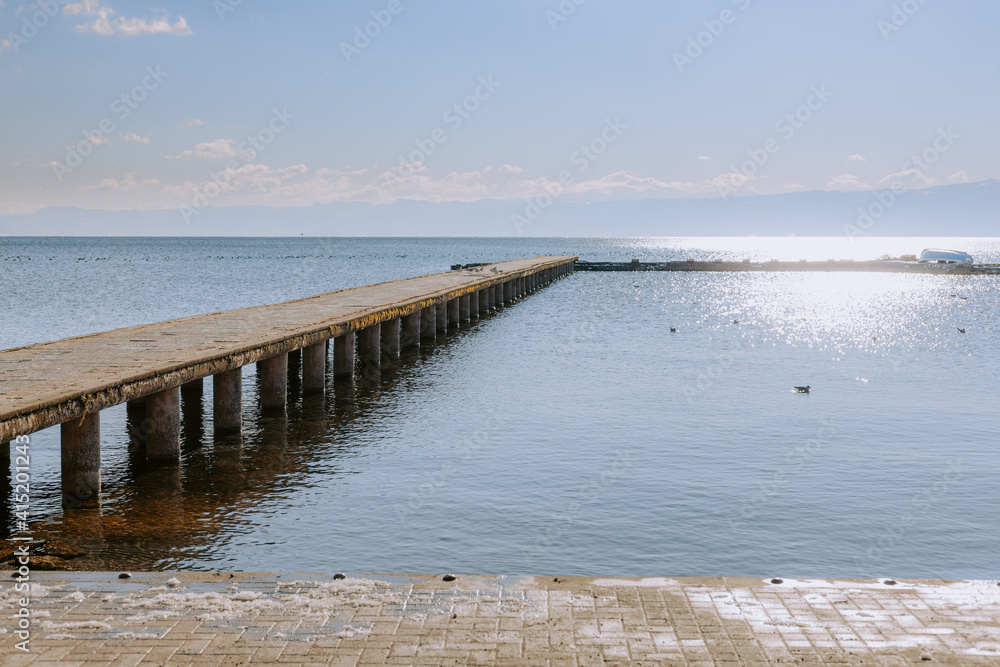Concrete pier on big lake in Europe