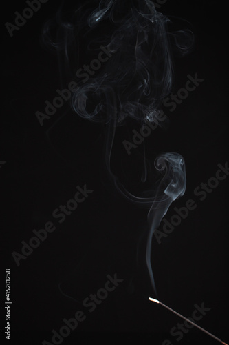 Fototapeta Naklejka Na Ścianę i Meble -  Incense burning giving of different patterns of smoke