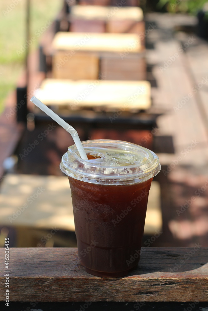 Iced americano coffee with ice on table at cafe. Iced americano coffee with ice on table at cafe.