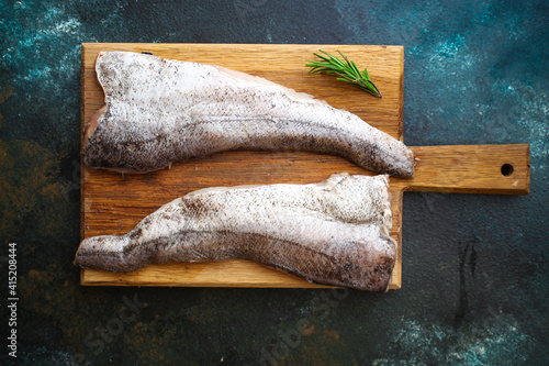 hake fish raw fillet seafood portion on the table cooking meal snack outdoor top view copy space for text food background rustic image keto or paleo diet vegetarian food pescetarian