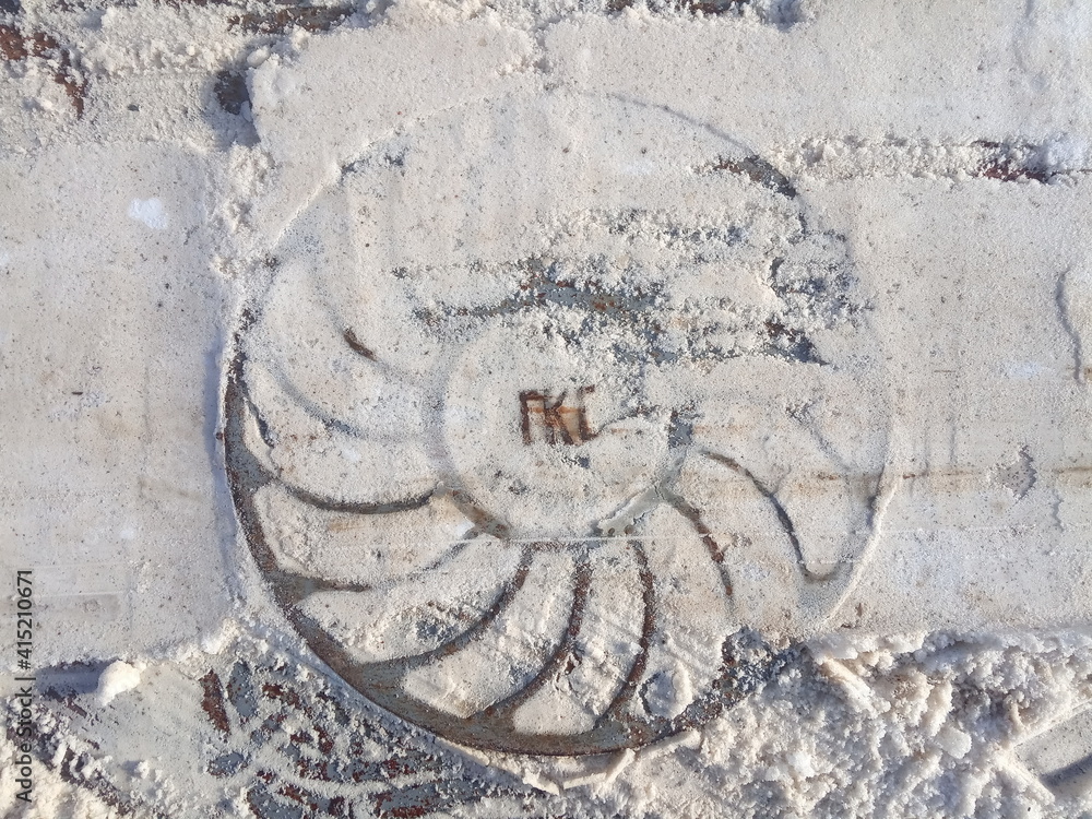 manhole in snow, sidewalk element, city winter