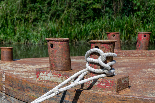 Rope tied on a mooring bitt on a narrow boat © NutfieldChase