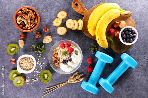 Fototapeta Naklejka Na Ścianę i Meble -  bowl with granola, berries,  nuts and yogurt