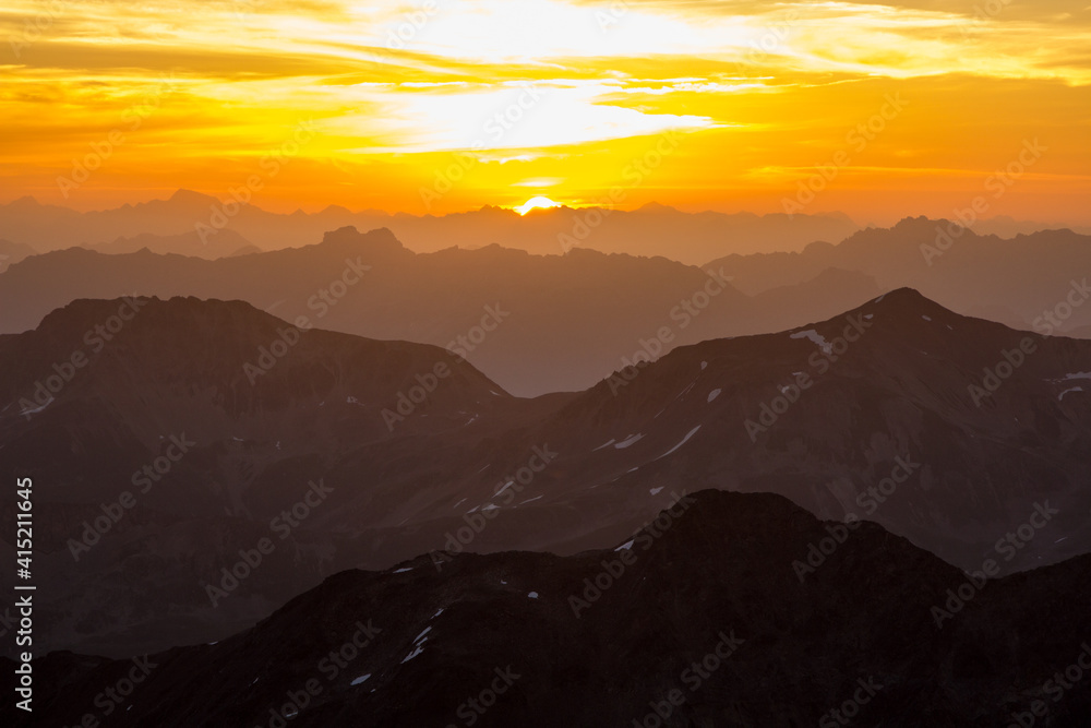 golden sunrise over mountain range in the swiss alps grisons bernina