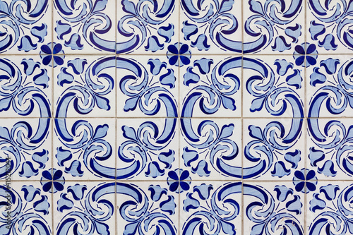 azure and pale blue floral pattern on handmade portuguese tiles photo