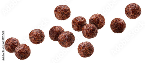 Fotografie Falling chocolate corn balls isolated on white background