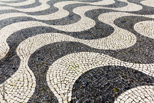 black and white waves stone paving on square in lisbon