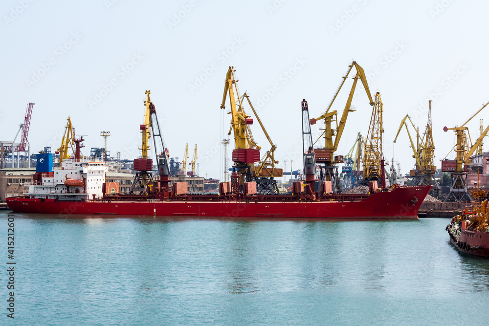 cargo ship and cranes in port