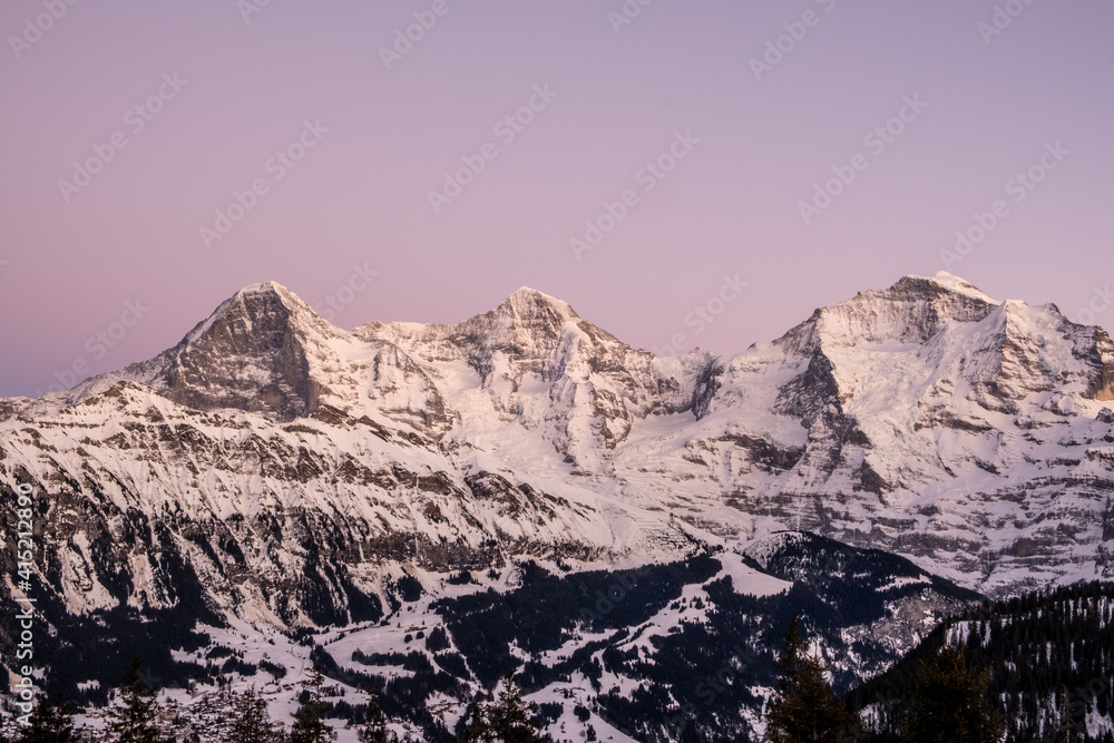 blue hour view of the bernese alps in lauterbrunnen grindelwald eiger mönch jungfrau