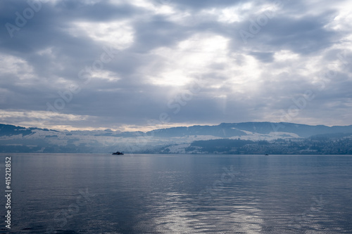 clouds over the lake zurich with a ship