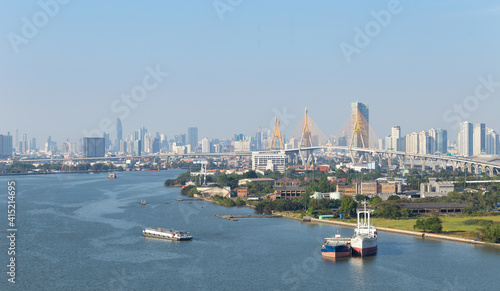 The landscape of the Chao Phraya River and the Bhumibol Bridge against the backdrop of Bangkok's skyscrapers