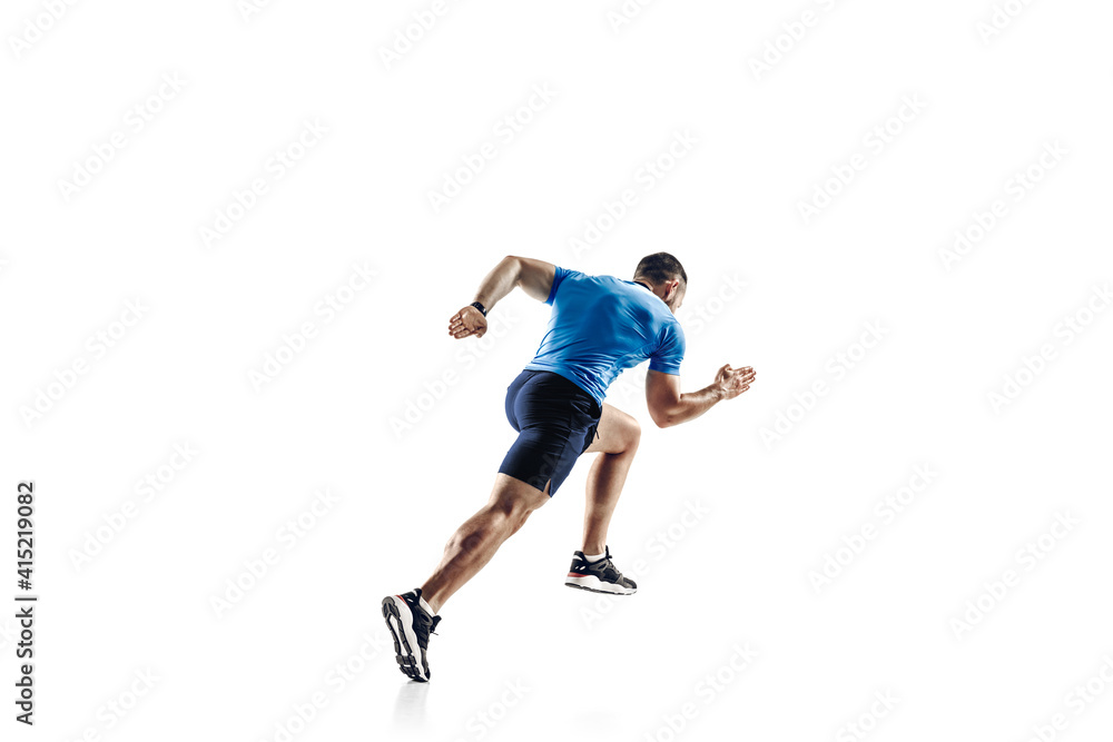 In jump. Caucasian professional male athlete, runner training isolated on white studio background. Muscular, sportive man. Concept of action, motion, youth, healthy lifestyle. Copyspace for ad. In jump. Caucasian professional male athlete, runner training isolated on white studio background. Muscular, sportive man. Concept of action, motion, youth, healthy lifestyle. Copyspace for ad.