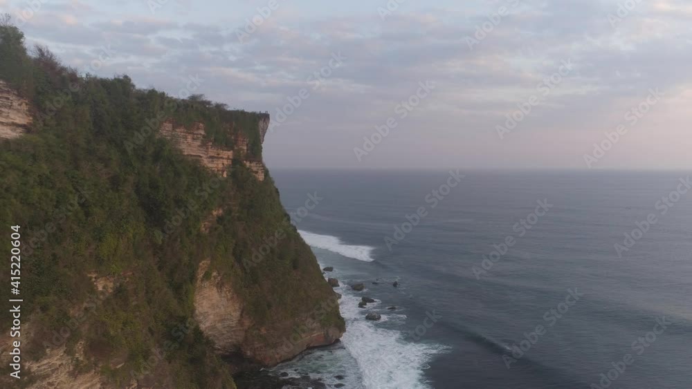 aerial view rocky ocean coastline at sunset. seascape waves break on rocky shore travel concept. aerial footage. aerial view rocky ocean coastline at sunset. seascape waves break on rocky shore travel concept. aerial footage.