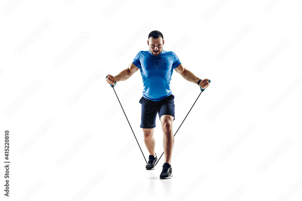 Practice. Caucasian professional male athlete, runner training isolated on white studio background. Muscular, sportive man. Concept of action, motion, youth, healthy lifestyle. Copyspace for ad.