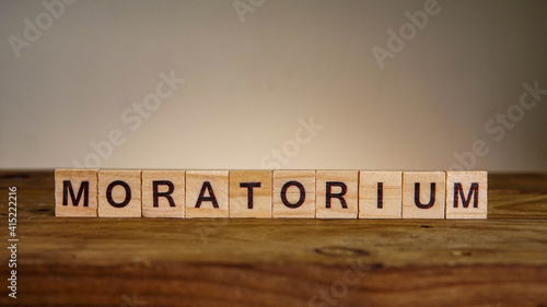 Fotografie MORATORIUM wording on wooden table. Finance concept.
