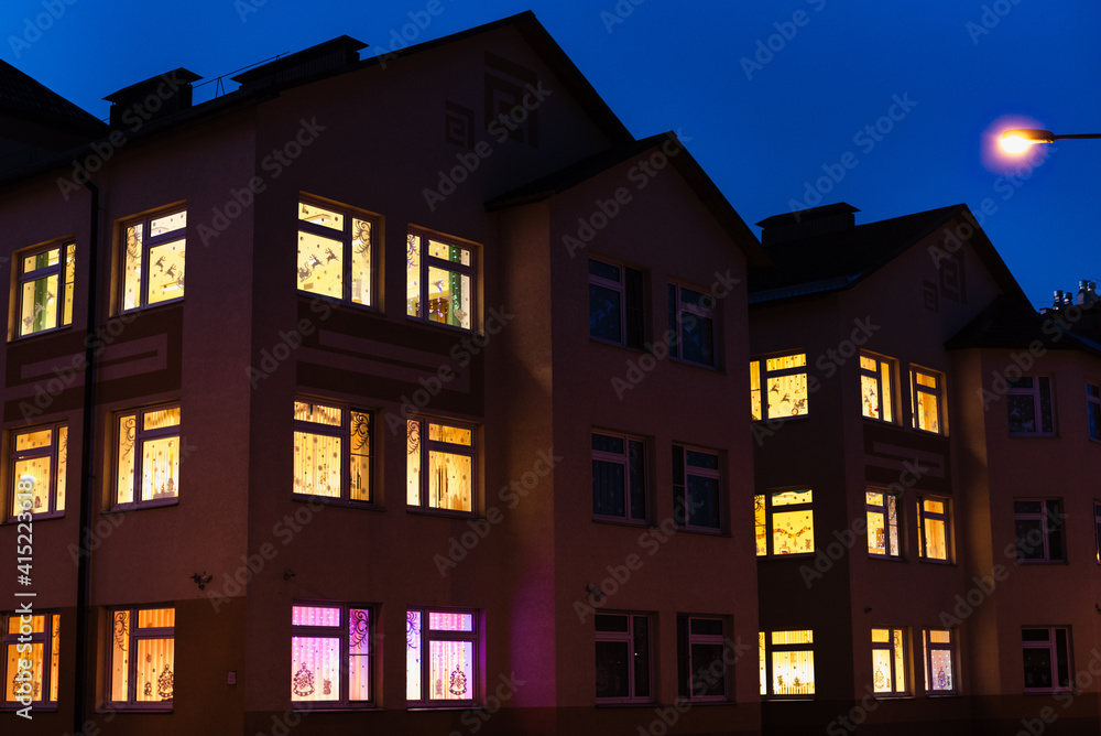 Fototapeta premium light in the windows, house at night, night city 