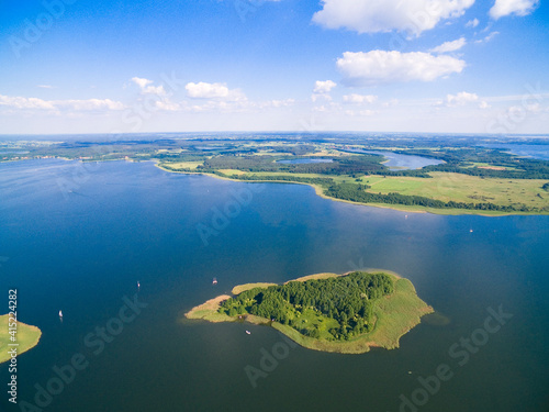 Aerial view of beautiful island on Swiecajty Lake in the neighborhood of Kal village, Mazury, Poland (former Kehlen or Kielno, East Prussia)