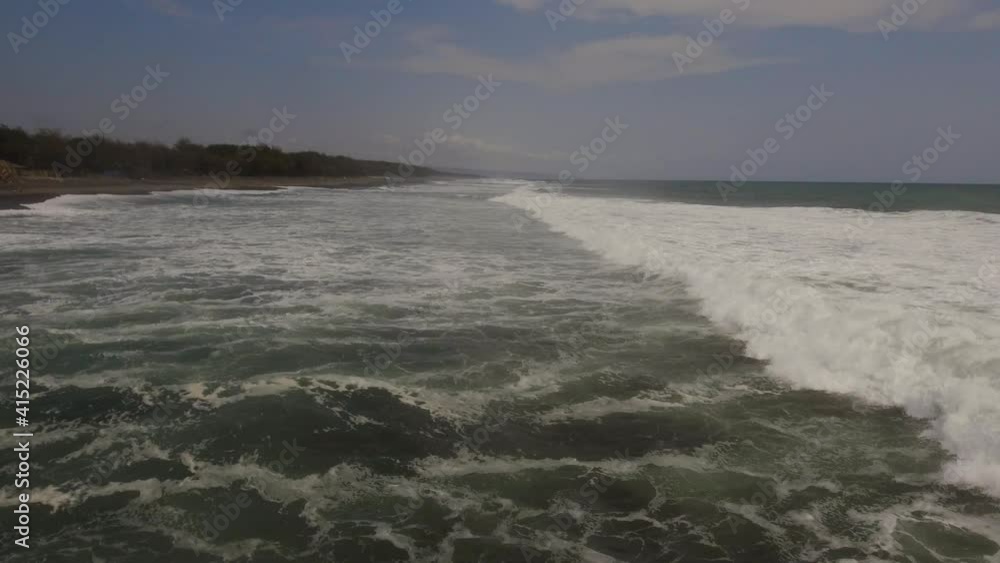 Aerial view seascape ocean waves surf. sandy beach near ocean with big waves in tropical resort, Yogyakarta, Indonesia. seascape, ocean and beautiful beach. Travel concept. Indonesia, java Aerial view seascape ocean waves surf. sandy beach near ocean with big waves in tropical resort, Yogyakarta, Indonesia. seascape, ocean and beautiful beach. Travel concept. Indonesia, java
