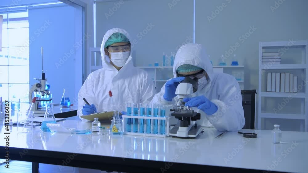 Research concept of 4k resolution. Scientists wear protective clothing to work in the laboratory. Research concept of 4k resolution. Scientists wear protective clothing to work in the laboratory.