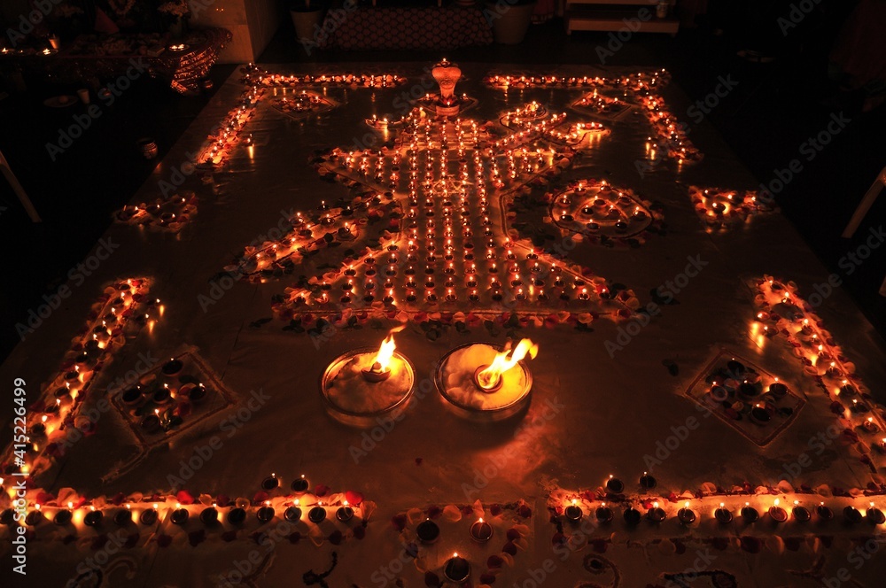 Decorative oil or wax burning traditional Diwali Diya or lamps arranged ...